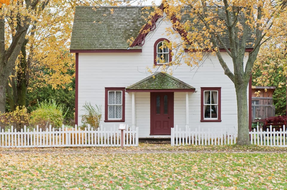 Kept-up home behind a picket fence