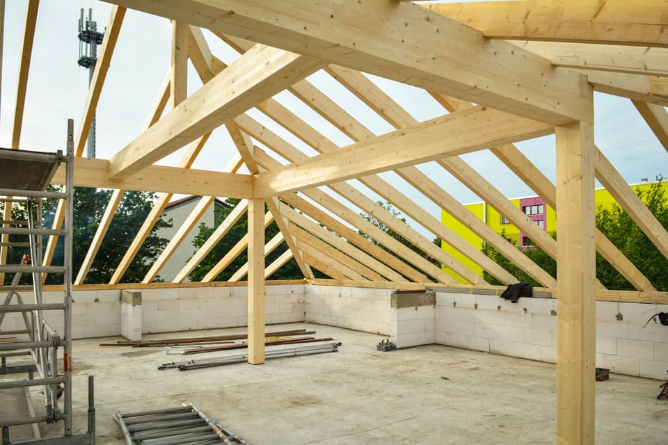 New timber roof framing against the sky