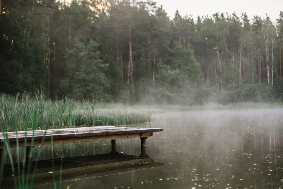 Wooden dock on a misty lake